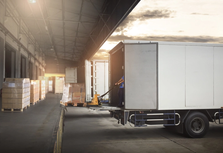 A commercial loading dock with a delivery truck