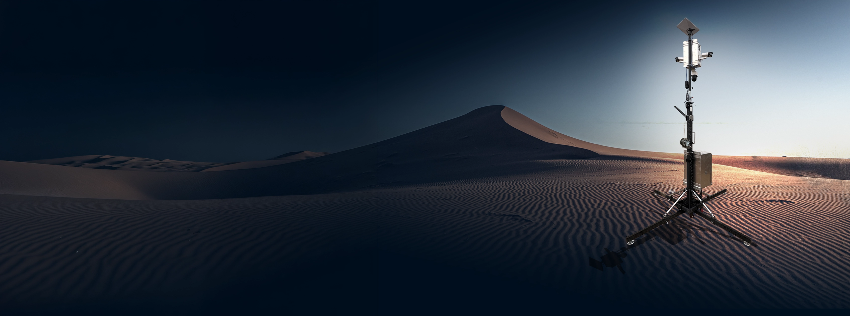 A remote camera tower deployed in a desert environment